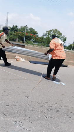 Metal sheets scattered across Abuja highway create traffic hazard