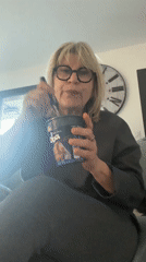Woman documents quiet evening at home with cat and noodles
