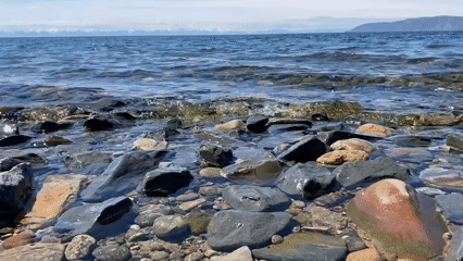 Peaceful morning captured at Lake Baikal shoreline near Listvyanka