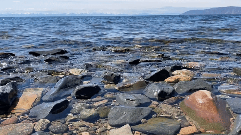 Peaceful morning captured at Lake Baikal shoreline near Listvyanka
