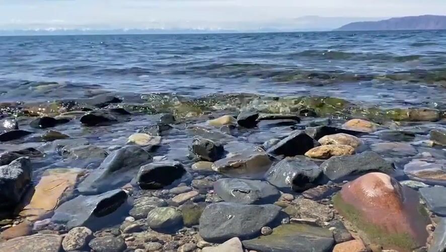 Peaceful morning captured at Lake Baikal shoreline near Listvyanka