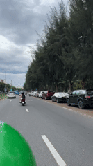 Late night traffic flows through coastal Đà Nẵng streets
