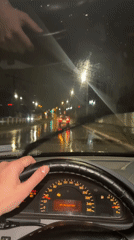Night driving through rainy Sofia streets captured from inside Mercedes