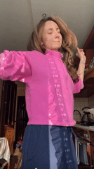 Woman enjoys afternoon dance session at home in Kryvyi Rih