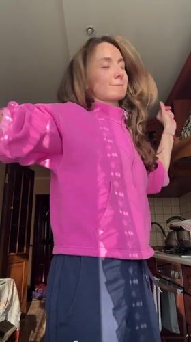 Woman enjoys afternoon dance session at home in Kryvyi Rih