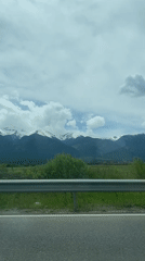 Driver captures snow-capped mountain views near Razlog, Bulgaria