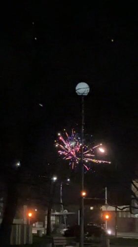 Nighttime fireworks display illuminates Karlovo, Bulgaria streets