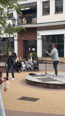 Street musician performs in Brest square, draws crowds