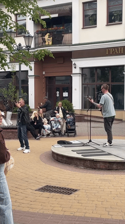 Street musician performs in Brest square, draws crowds