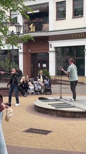 Street musician performs in Brest square, draws crowds