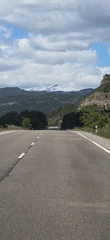 Vehicle travels mountain road near Perarrúa, Spain