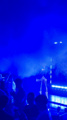 Female performers dance at Sofia nightclub amid blue lighting