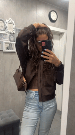 Woman takes mirror selfies showing blue manicure in Moscow region