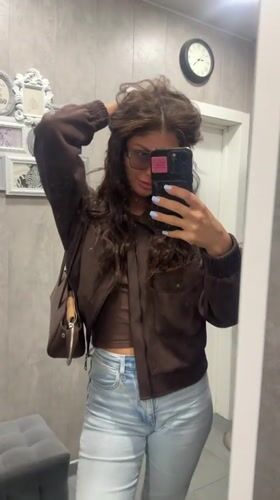 Woman takes mirror selfies showing blue manicure in Moscow region