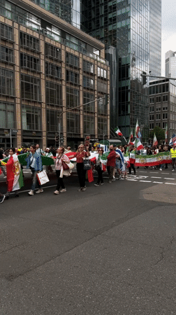 Political demonstration marches through downtown Frankfurt streets