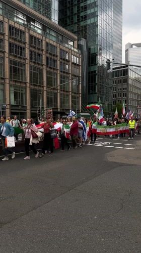 Political demonstration marches through downtown Frankfurt streets