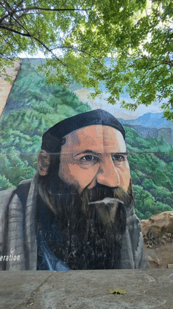 Street art and parked vehicle documented in Tbilisi