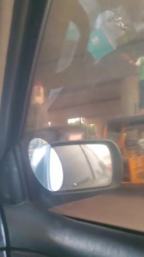 Woman filmed from dashboard camera in moving car, Nigeria