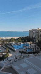 Evening at a Nesebar resort pool and palm walkways