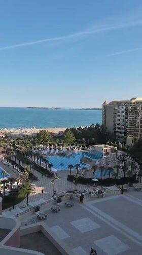 Evening at a Nesebar resort pool and palm walkways