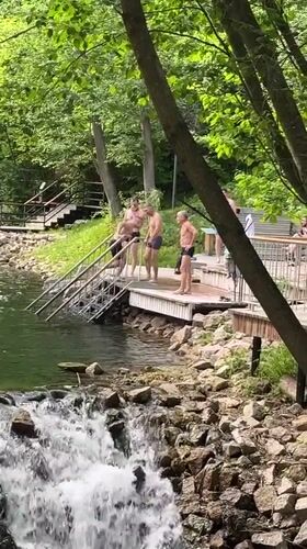 Wooden platform and waterfall at a Kazan waterfront access point