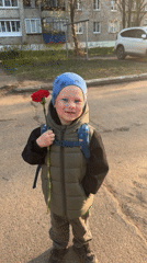 Child with red carnation observed in Chaikovsky, Russia