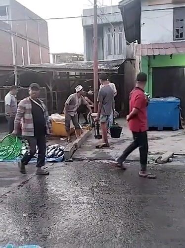 Evening fish market activity captured in Lhokseumawe, Indonesia