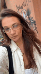 Woman records selfie video on Athens street