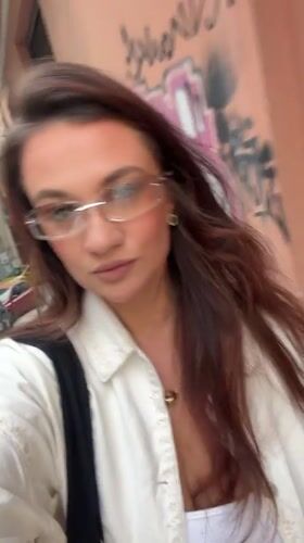 Woman records selfie video on Athens street