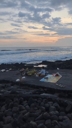 Traditional oceanside ceremony and beach sunset activities in Indonesia