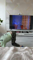 Child watches cartoons at home with decorated cake present