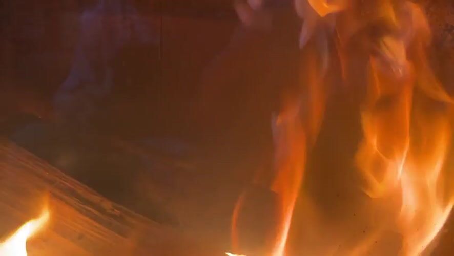 Evening scenes captured in Bulgarian village: fireplace flames, sunset clock