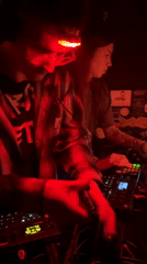 Electronic music event with red lighting documented in Zagreb