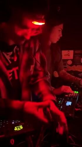 Electronic music event with red lighting documented in Zagreb