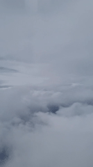 Dense clouds blanket Bulgarian skies, obscuring ground visibility
