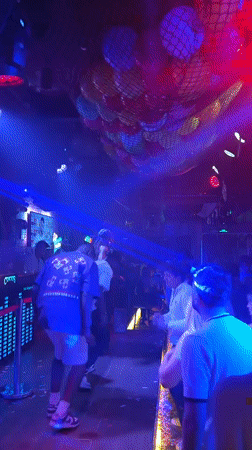 Crowded nightclub scene captured in Haizhu District evening