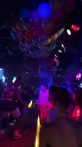 Crowded nightclub scene captured in Haizhu District evening