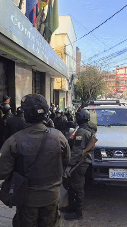 Riot police gather outside building in La Paz