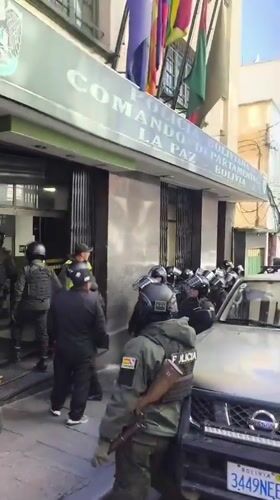 Riot police gather outside building in La Paz