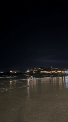 Nighttime beach activity captured in Nha Trang, Vietnam