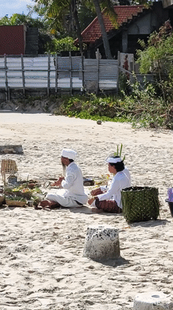 Traditional Balinese ceremony with musicians held on Nusa Penida beach