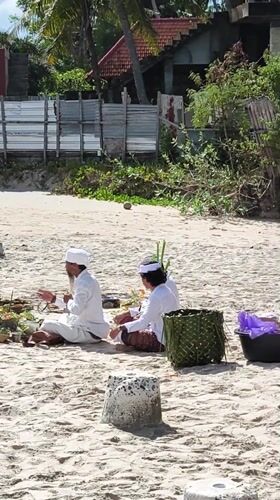 Traditional Balinese ceremony with musicians held on Nusa Penida beach