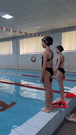 Young swimmers prepare on starter blocks in Birobidzhan pool