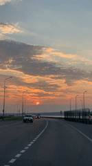 Sunset road leading to water in Chaikovsky, Russia