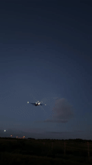 Commercial jet lifts off at dusk near Moscow