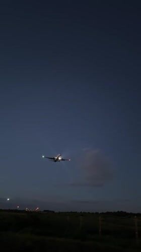 Commercial jet lifts off at dusk near Moscow