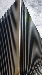 Film crew shoots outside distinctive striped building