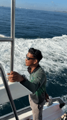Man observed on moving boat near Denpasar, Indonesia