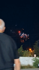 Fireworks and dancing at an outdoor evening gathering