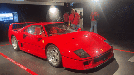 Visitors document Ferrari displays during Maranello facility tour